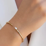 Load image into Gallery viewer, Dainty Pear Diamond Gold Cuff Bracelet | 14K Yellow Gold, Bezel Set Lab Grown Stone, VS+ Clarity, 0.30 CT, Bridal, Stacking, Gift for Women Jwalin Jewels