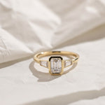 Load image into Gallery viewer, Lab Grown Emerald Cut Diamond Engagement Ring 2 Carat VS1 F Color 14K Gold Bezel Set with Trapezoid Side Stones